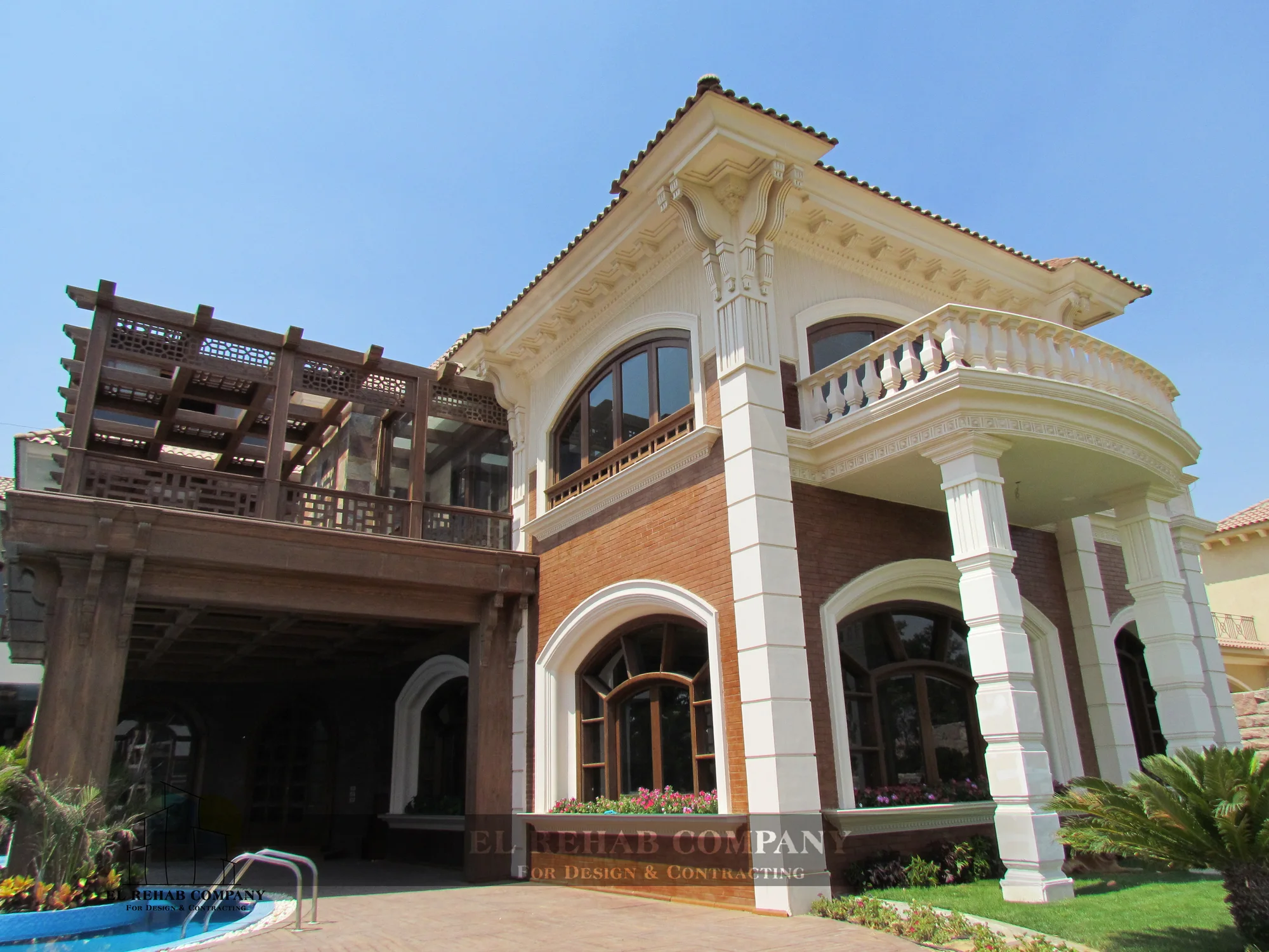 Garden elevation with arched windows and timber pergola