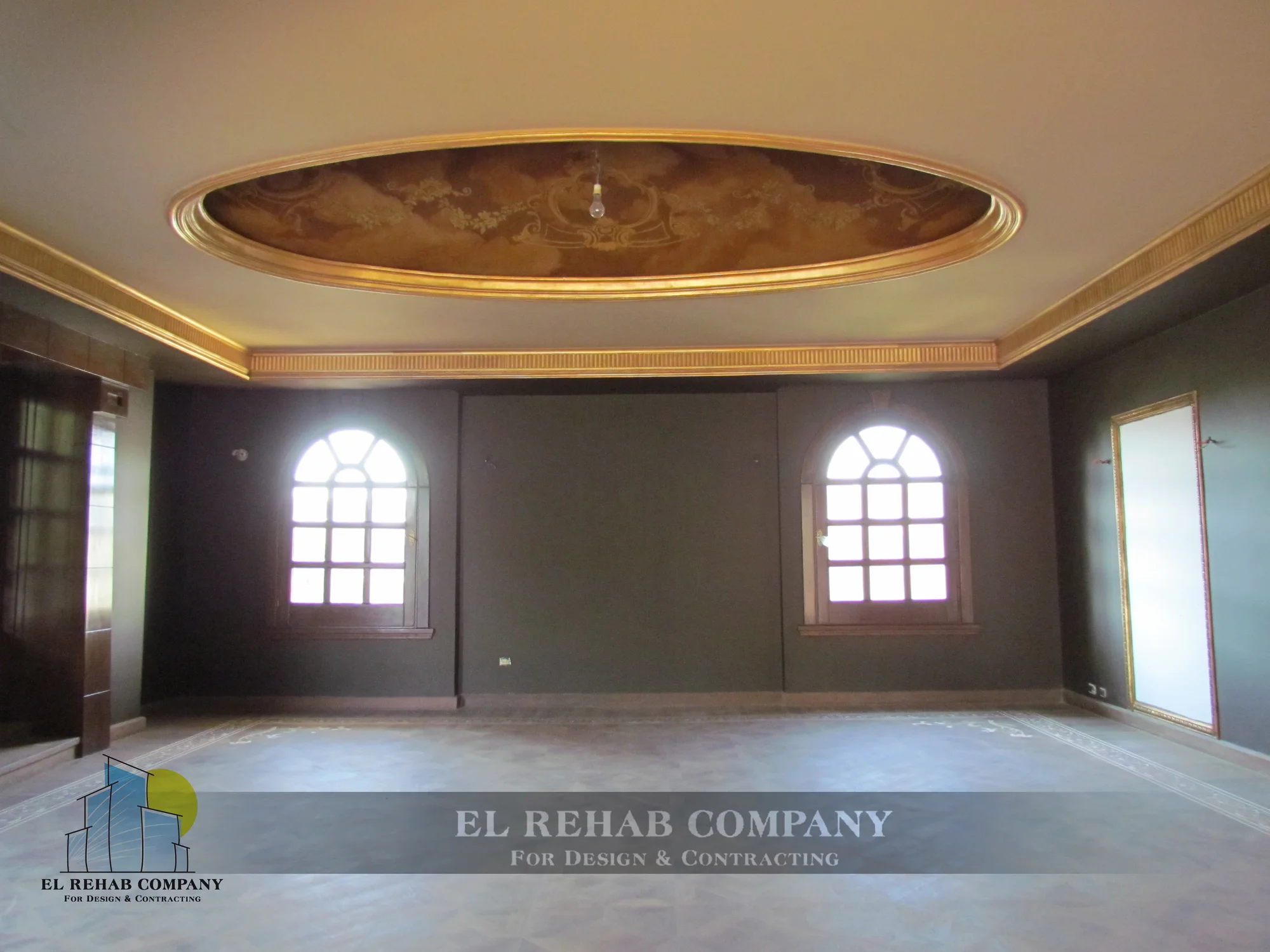 Reception room with decorative ceiling and arched windows